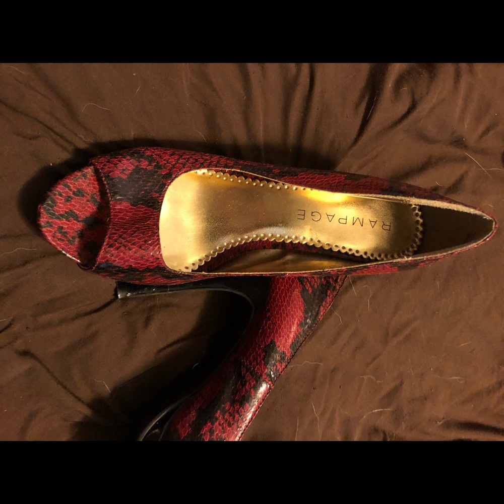 Black and red snakeskin peep toe heals.